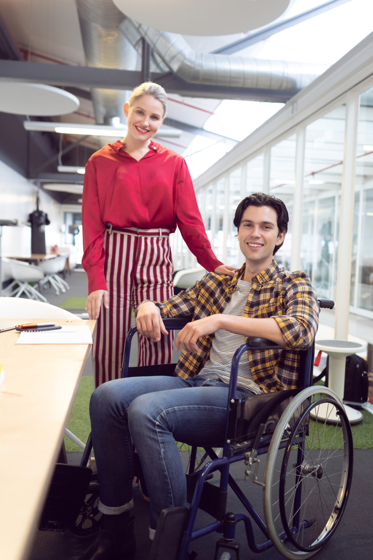 "Young woman and man, including one in a wheelchair, supported by No Limits Care's inclusive Supported Independent Living Melbourne programs.